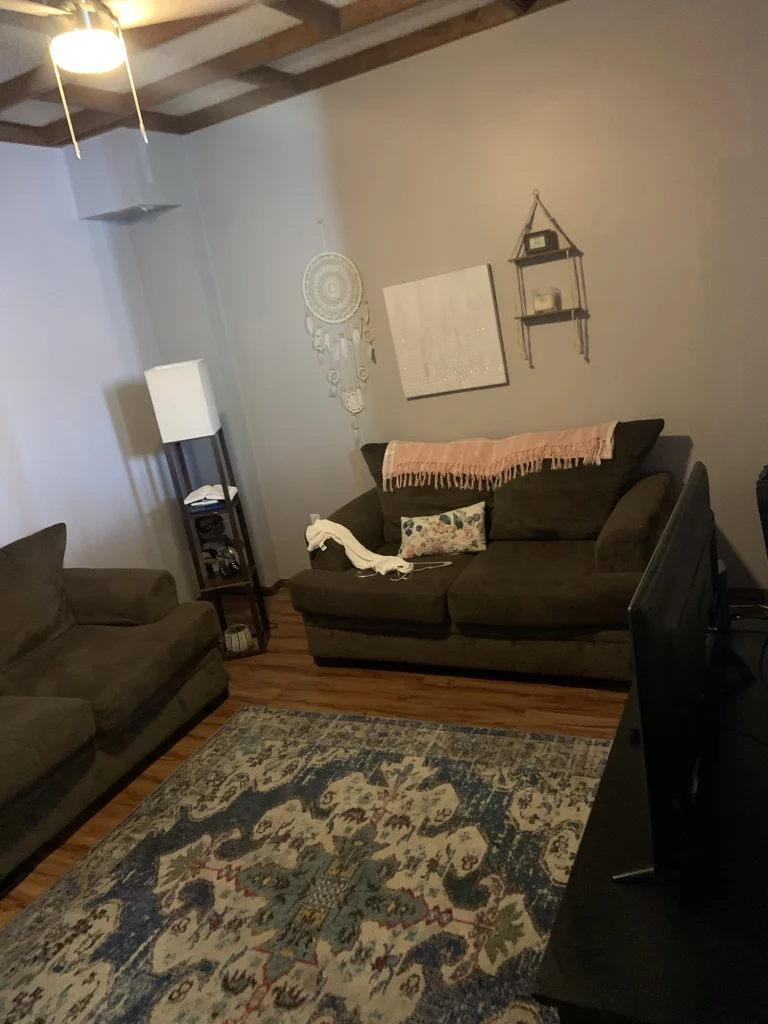 Cozy living room with plush sofas at Sober House Philadelphia, a sober living home in Delaware.