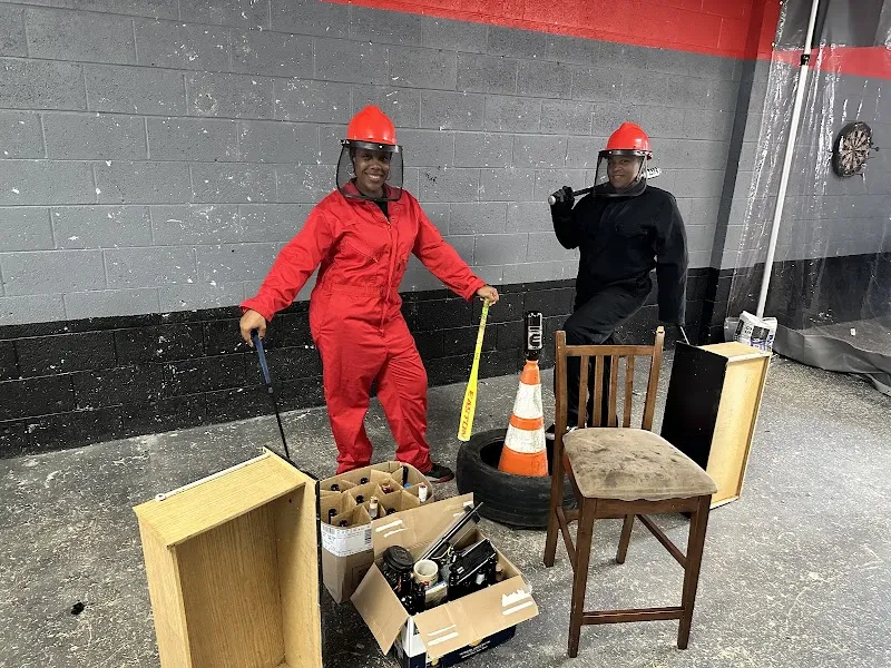 Participants in safety gear at The Smash House, a sober living home in Delaware, prepare for a therapeutic activity.