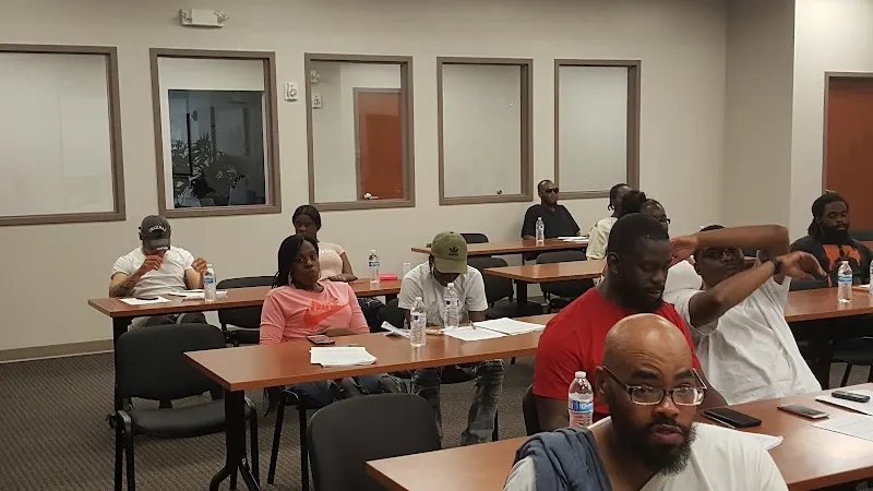 Group of individuals in a meeting room at Wilmington HOPE Commission's sober living home in Delaware.