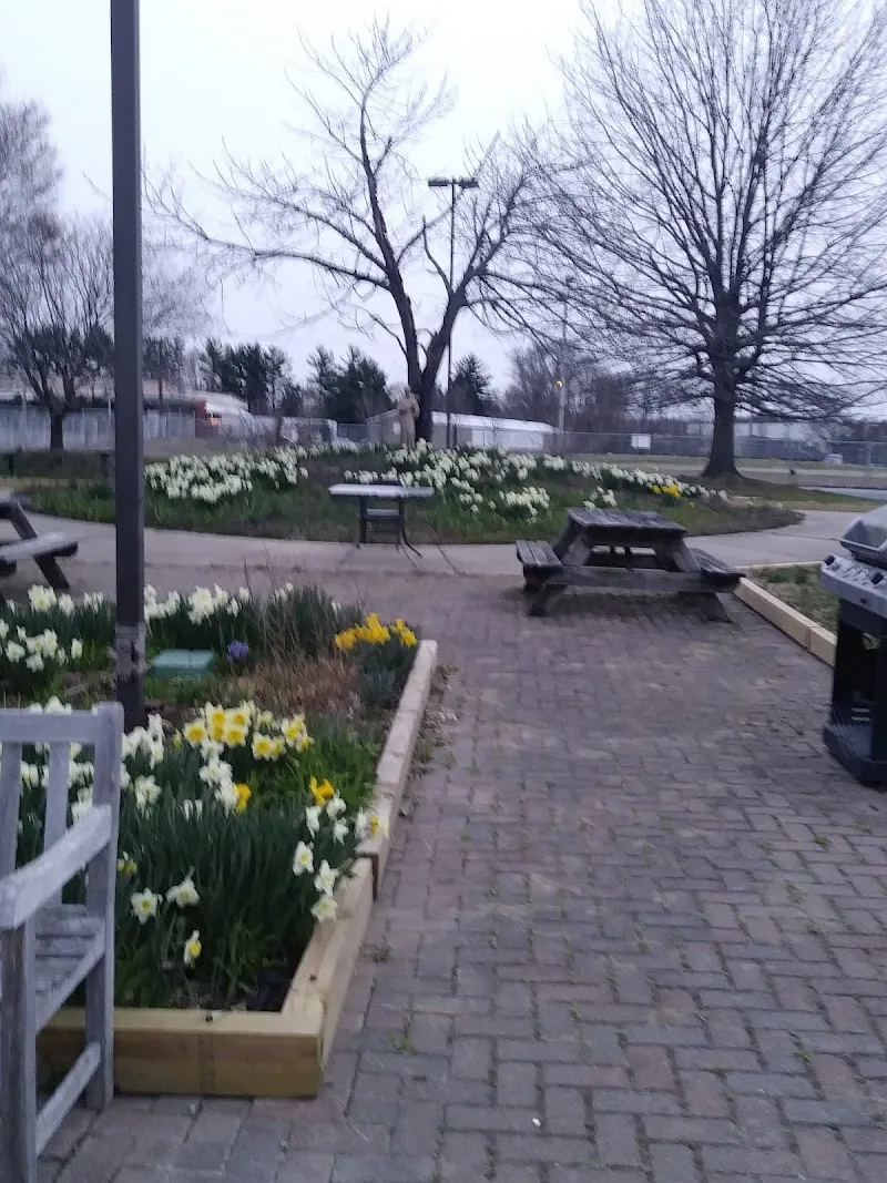 Landscaped garden area with benches at Sojourners' Place, a sober living home in Delaware.