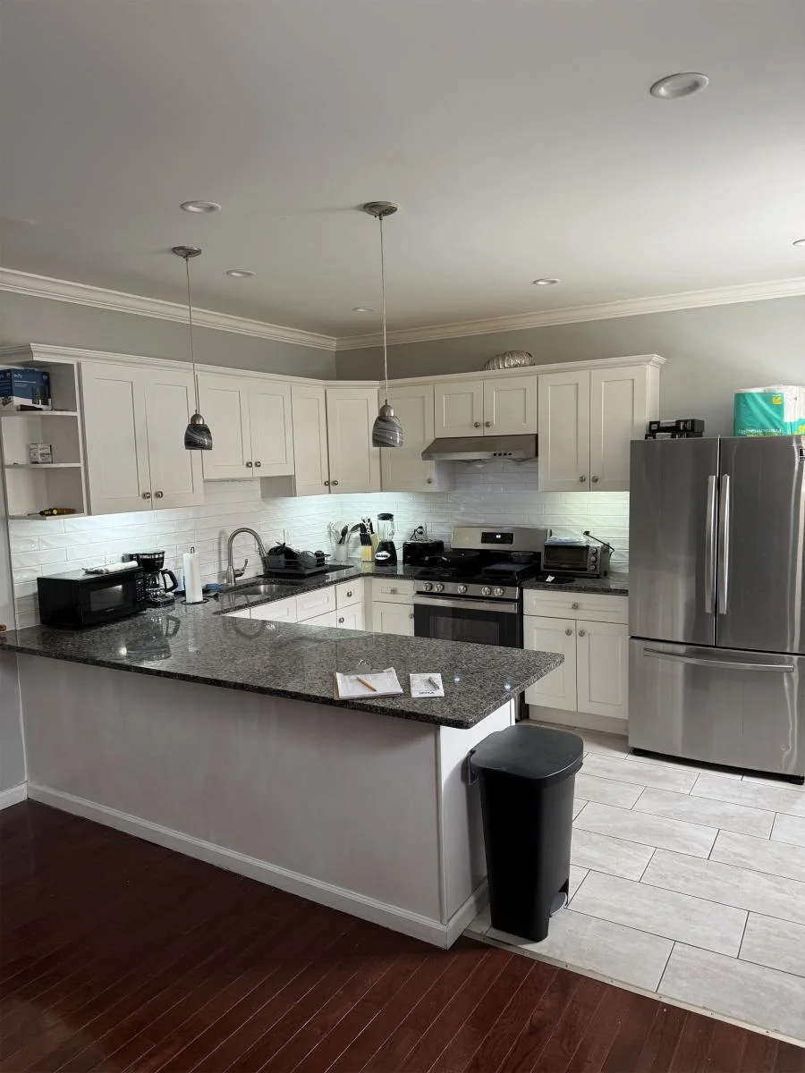Modern kitchen with island at Renewal Sober Homes of Philadelphia, a sober living home in Delaware.