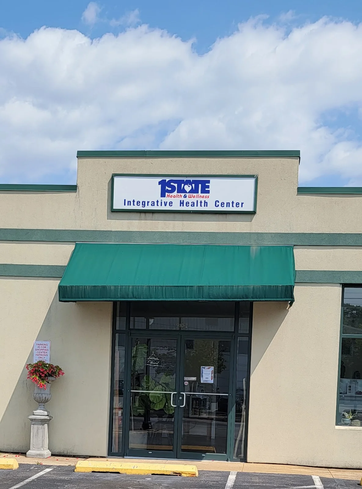 Green awning over entrance of First State Health & Wellness treatment center in Delaware.